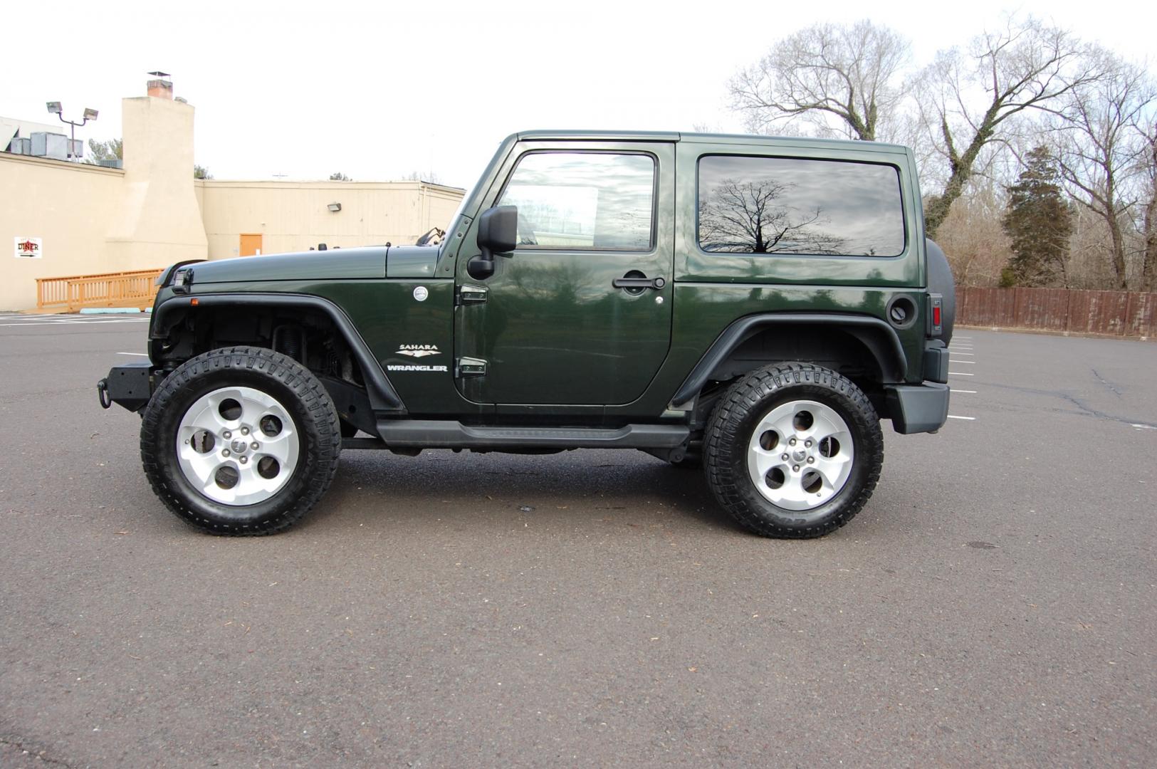 2011 Green /Tan leather Jeep Wrangler Sahara 4WD (1J4AA5D10BL) with an 3.8L V6 OHV 12V engine, 6 Speed Manual transmission, located at 6528 Lower York Road, New Hope, PA, 18938, (215) 862-9555, 40.358707, -74.977882 - Here we have a nice running and driving Jeep Wrangler with a 3.8L V6 putting power to a 4x4 manual transmission. Options include Tan leather, AC, heat, heated front seats, power windows/locks/mirrors, AM/FM/SAT/DISC/AUX radio, cruise control, tilt steering wheel, auto headlights, 3 piece removable h - Photo#1